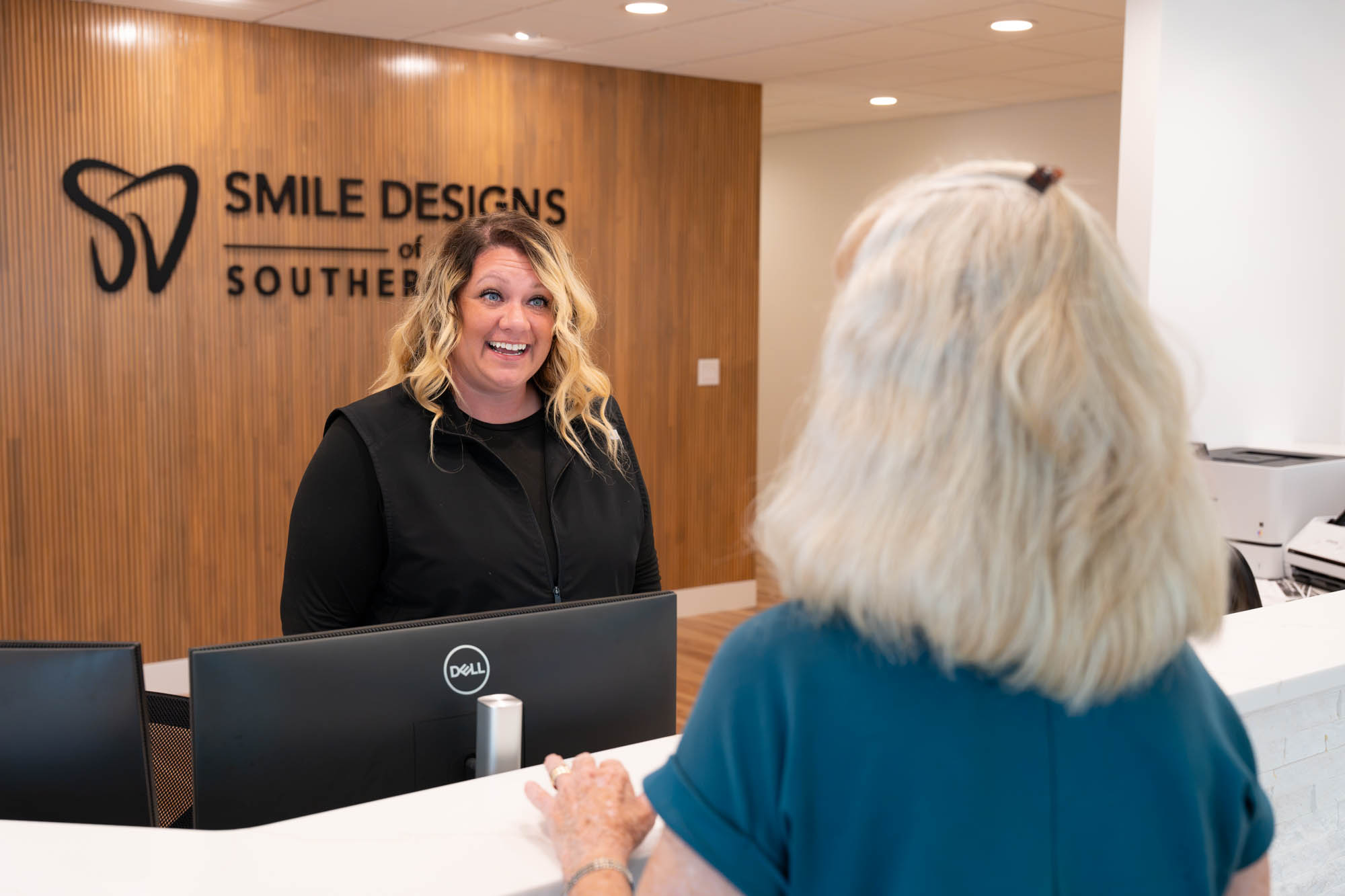 Front desk team member greeting a patient