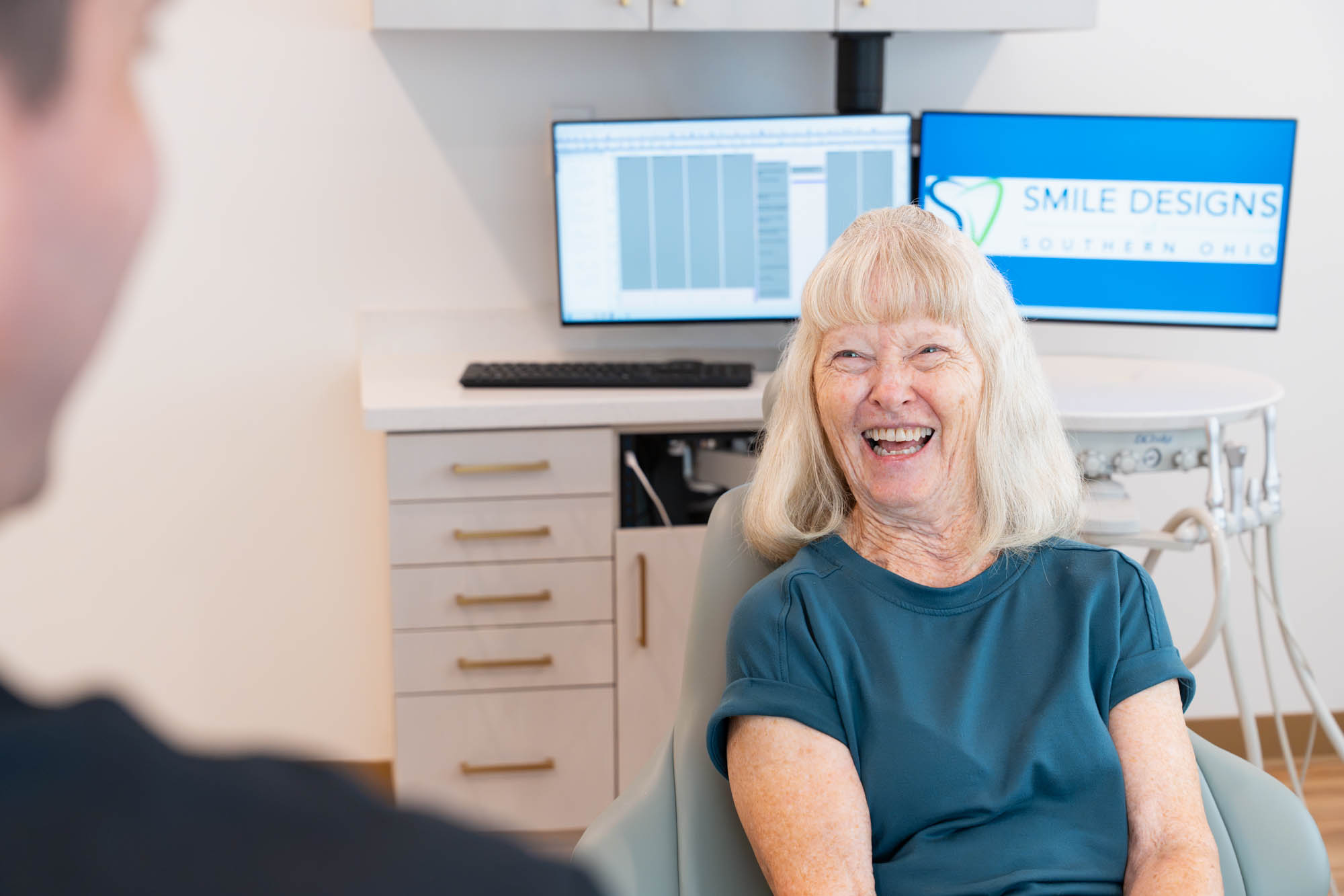Smiling patient in the treatment chair