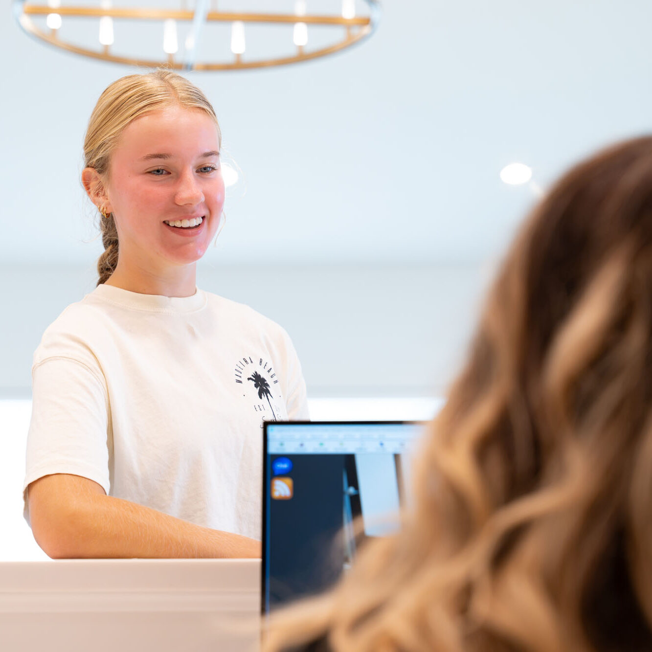 Smiling teen patient at the front desk